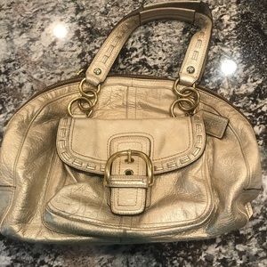 Gold metallic Coach bag.